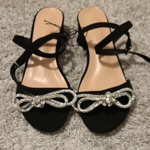 Elegant Black Sandals with Silver Accents and Ankle Straps
